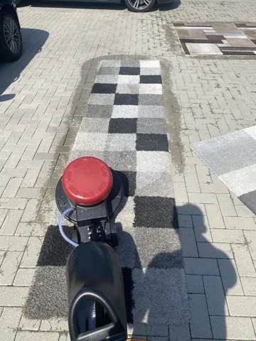 Maschinelle Reinigung einer Fußmatte